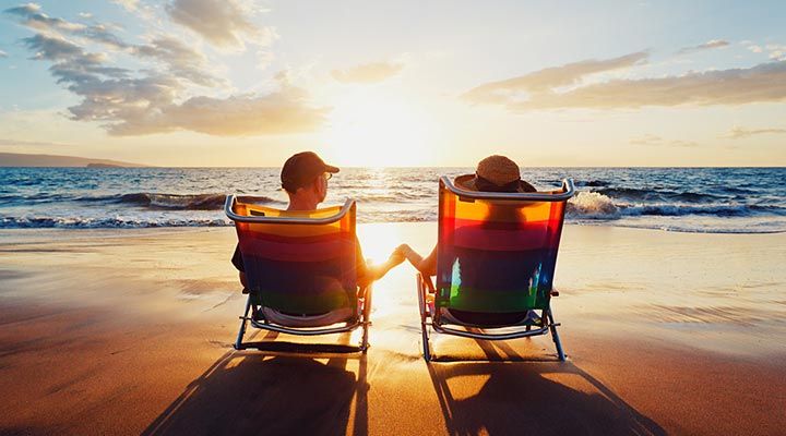 Couple watching the sunset on the beach
